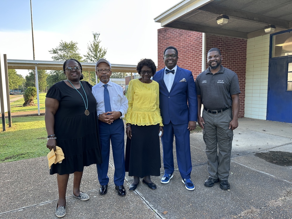 Prayer warriors pose with BSMS Assistant Principal Joseph Stone