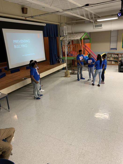 BSMS student council members presenting on bullying prevention with Officer Dobbins