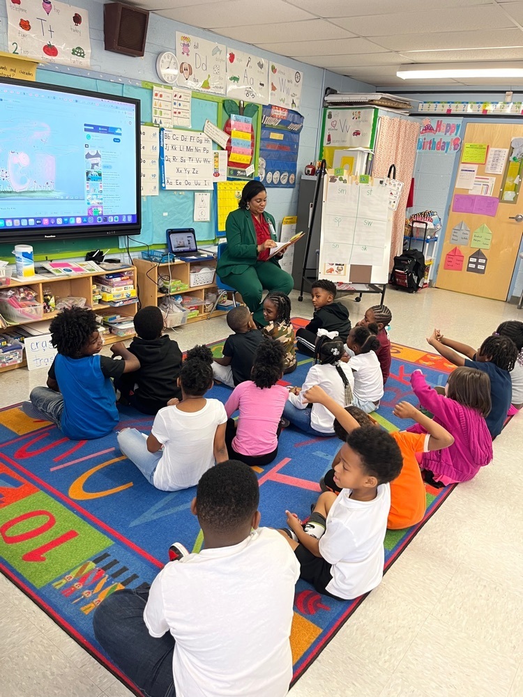 Superintendent Dr. Smith reading to Mrs. Williamson’s class